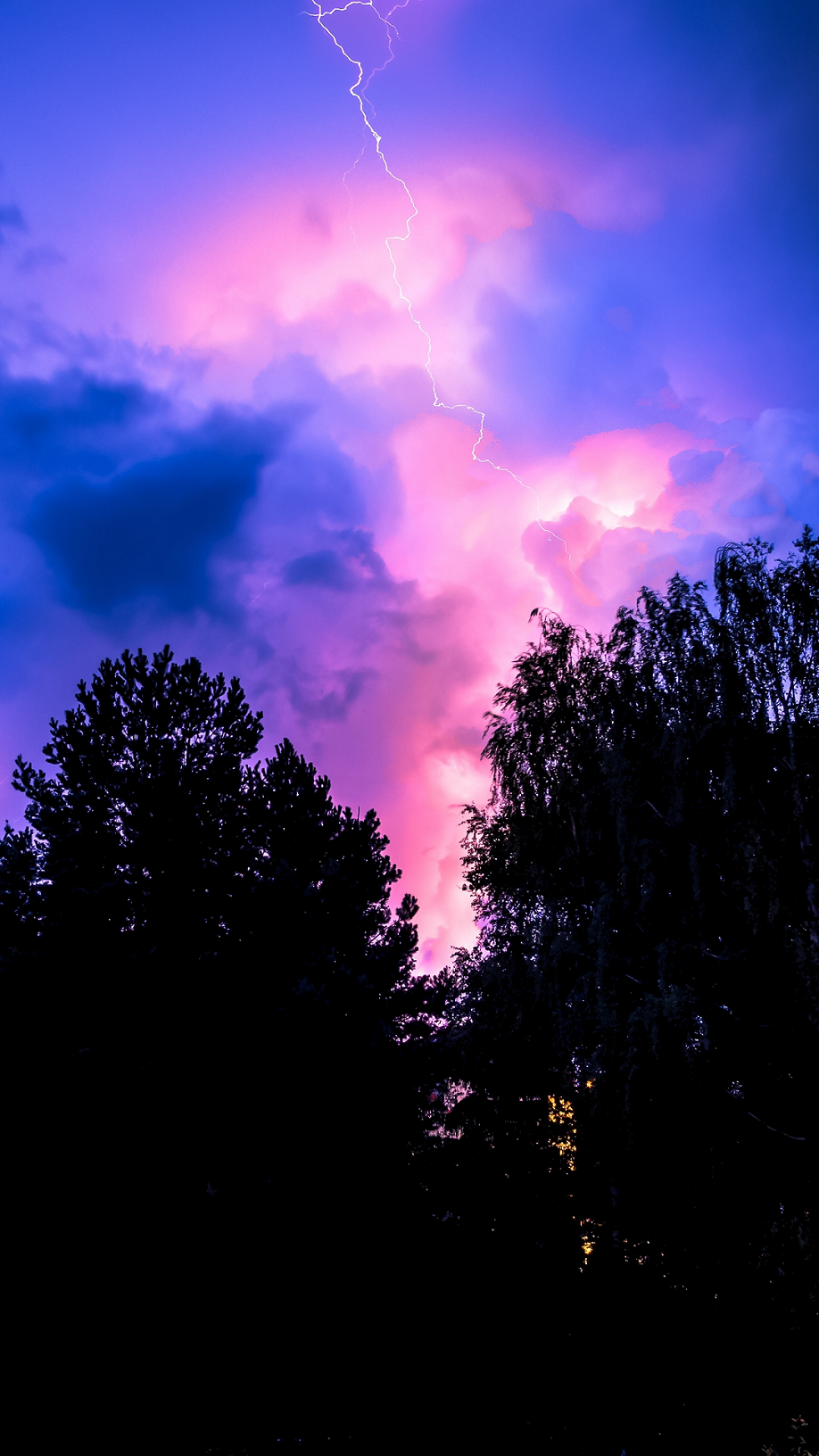 OLED-wallpaper-idownloadblog-trees-lightning-clouds