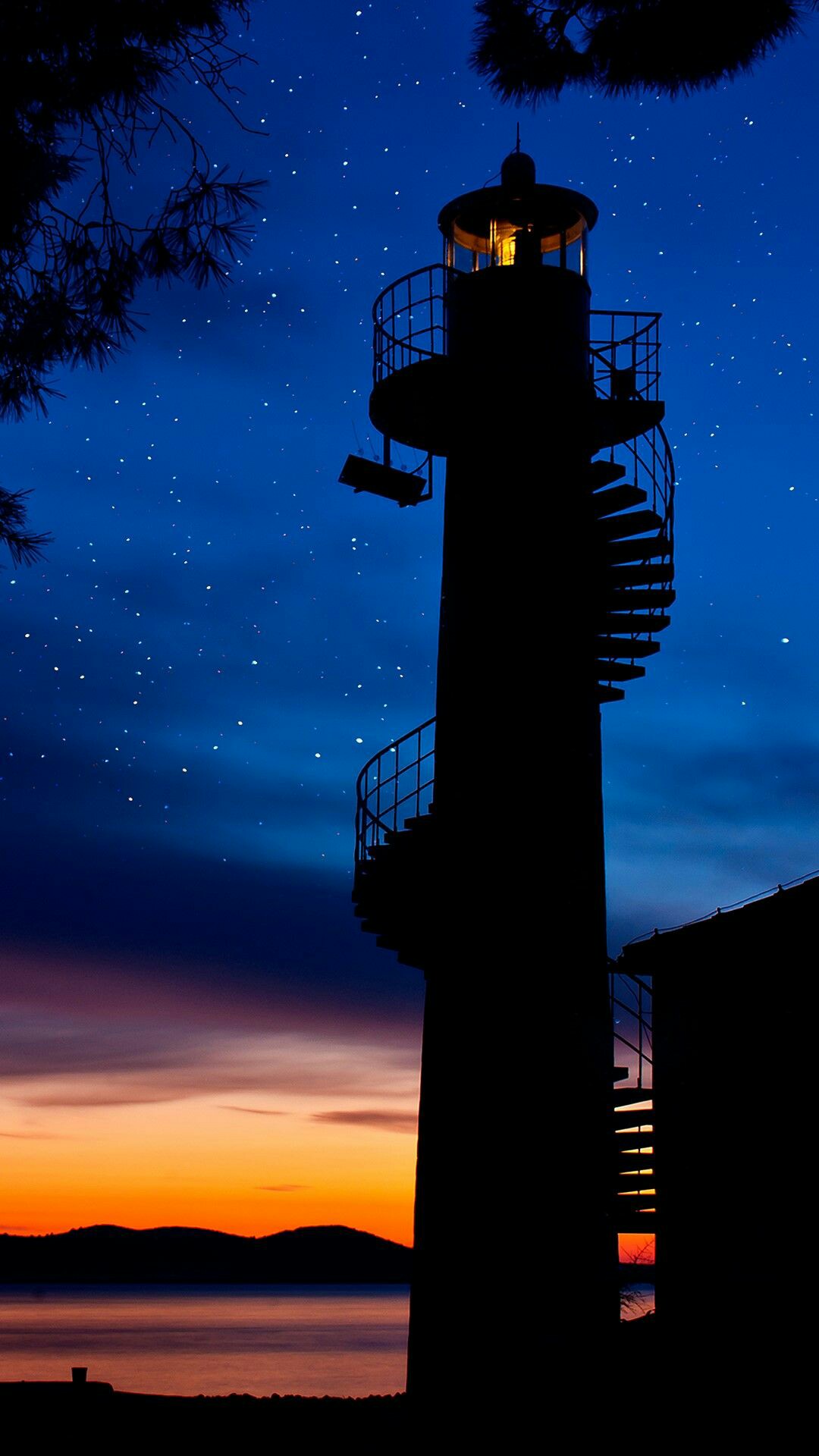 iphone-oled-wallpaper-idownloadblog-lighthouse-starry-sky