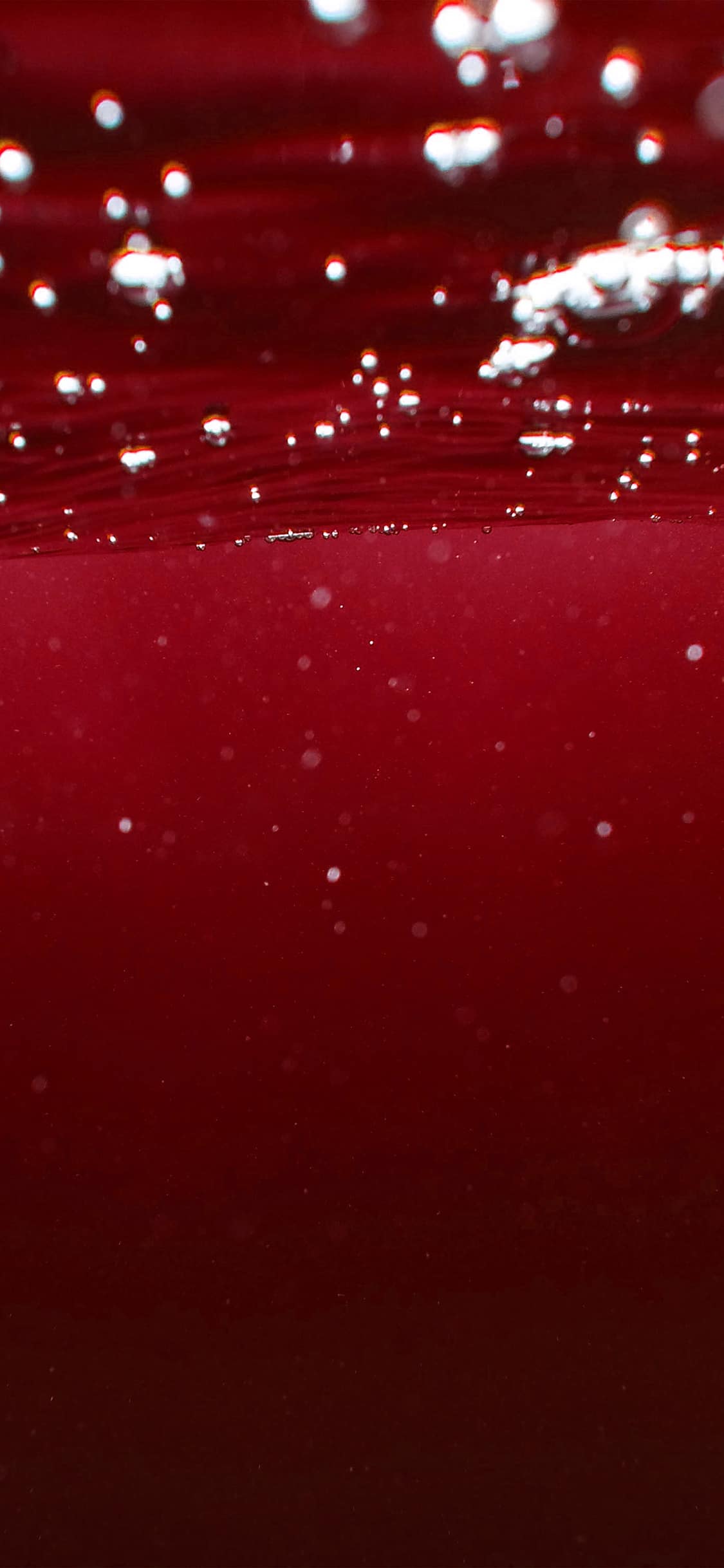 iPhone-11-wallpaper-bubble-underwater-swim-red-dark-pattern-iphone-X