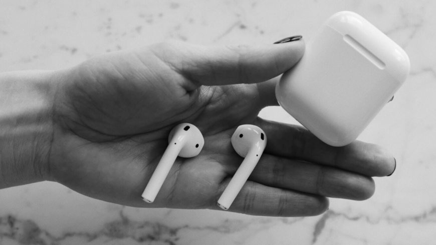 airpods-and-its-case-on-palm-1536×759