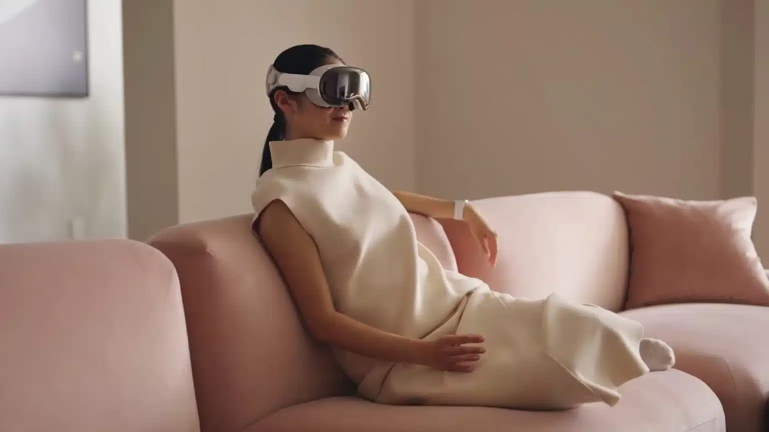 Apple-Vision-Pro-mixed-reality-headset-woman-couch-hand-gestures-1536×864