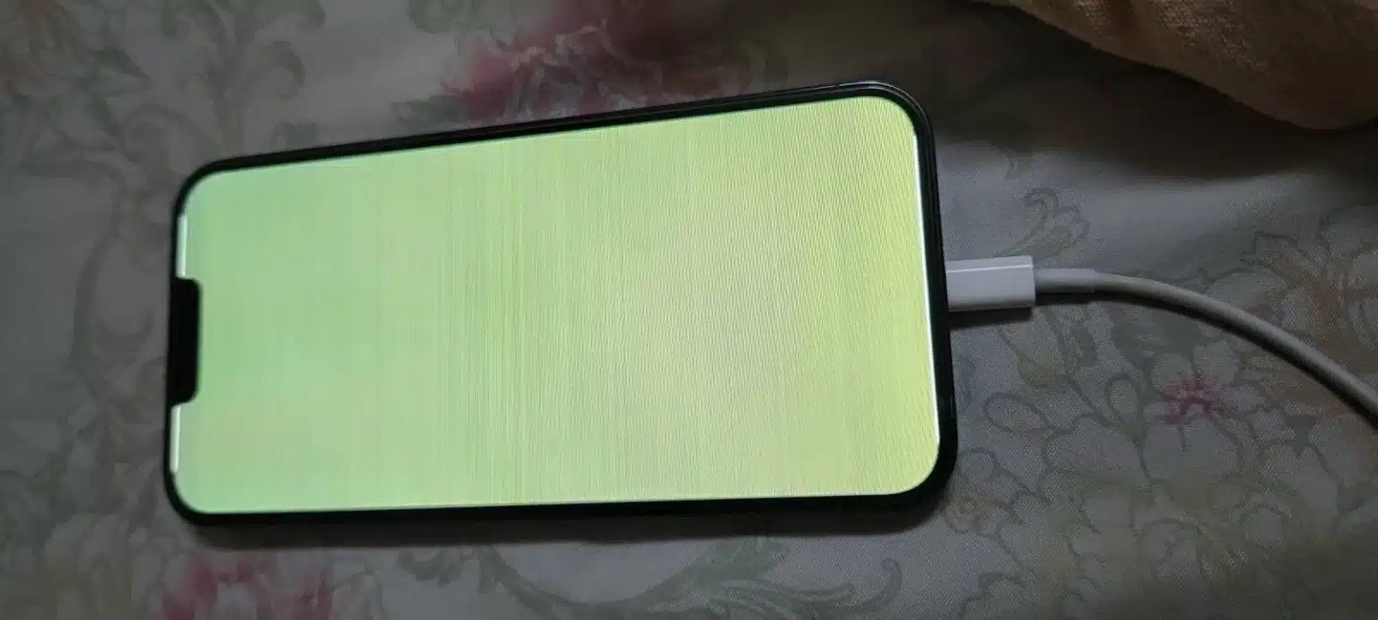 iPhone-with-full-green-screen-plugged-into-charging-1536×691