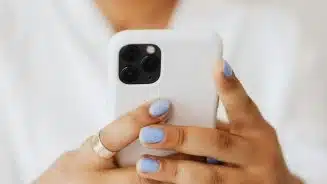 Woman-holding-an-iPhone-1536×864